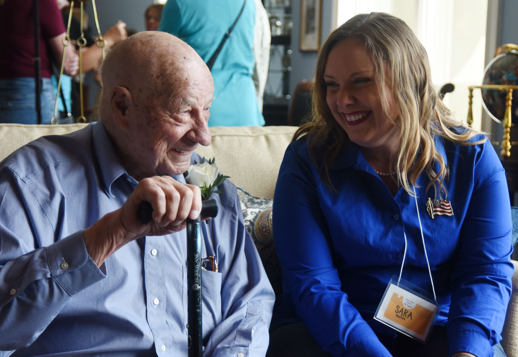 Charlie Koelling and state Rep. Sara Walsh laugh